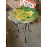 A GLASS DAFFODIL DESIGN BIRD BATH WITH METAL STAND