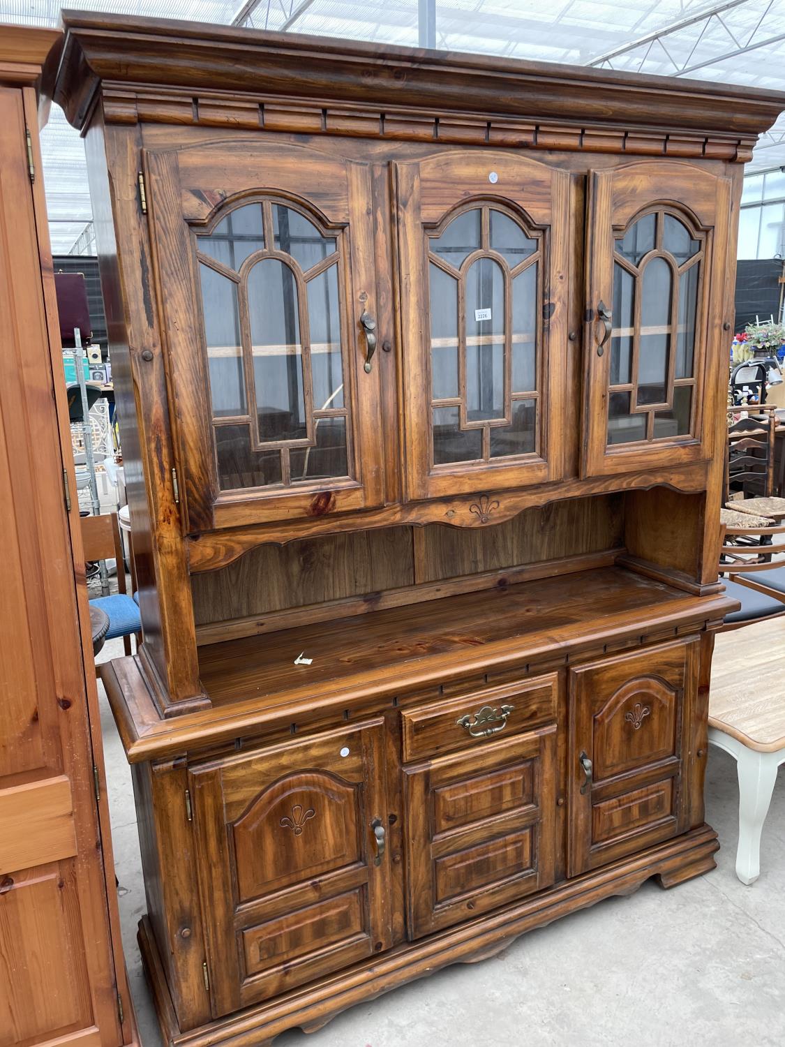 A MODERN PINE GLAZED CABINET ON BASE, 60" WIDE