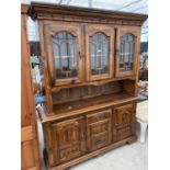 A MODERN PINE GLAZED CABINET ON BASE, 60" WIDE