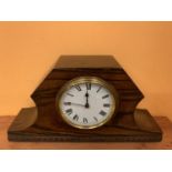 A DECO STYLE WOODEN MANTLE CLOCK