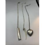 THREE SILVER NECKLACES WITH PENDANTS TO INCLUDE A HEART LOCKET, PEARLISED TOOTH AND A BAR WITH A