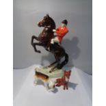 A BESWICK REARING BAY HORSE HUNTSMAN WITH A FOX AND A HOUND
