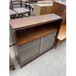 A MID 20TH CENTURY MAHOGANY SLIDING GLASS FRONTED BOOKCASE, 36" WIDE