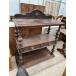 A VICTORIAN OAK HEAVILY CARVED THREE TIER BUFFET WITH TWO DRAWERS AND TURNED UPRIGHTS, 42" WIDE