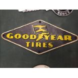 A CAST IRON GOODYEAR SIGN