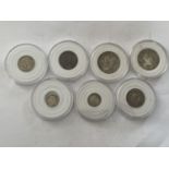 SEVEN COINS CAPSULES - 1816 AND 1826 SHILLINGS, 1911 AND OTHER FLORIN, 1891 AND 1898 THREEPENNY