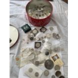A MIXED LOT OF COINS HOUSED IN CARDBOARD BOX . THE CONTENTS INCLUDE COIN POUCHES , A TIN OF MIXED TO