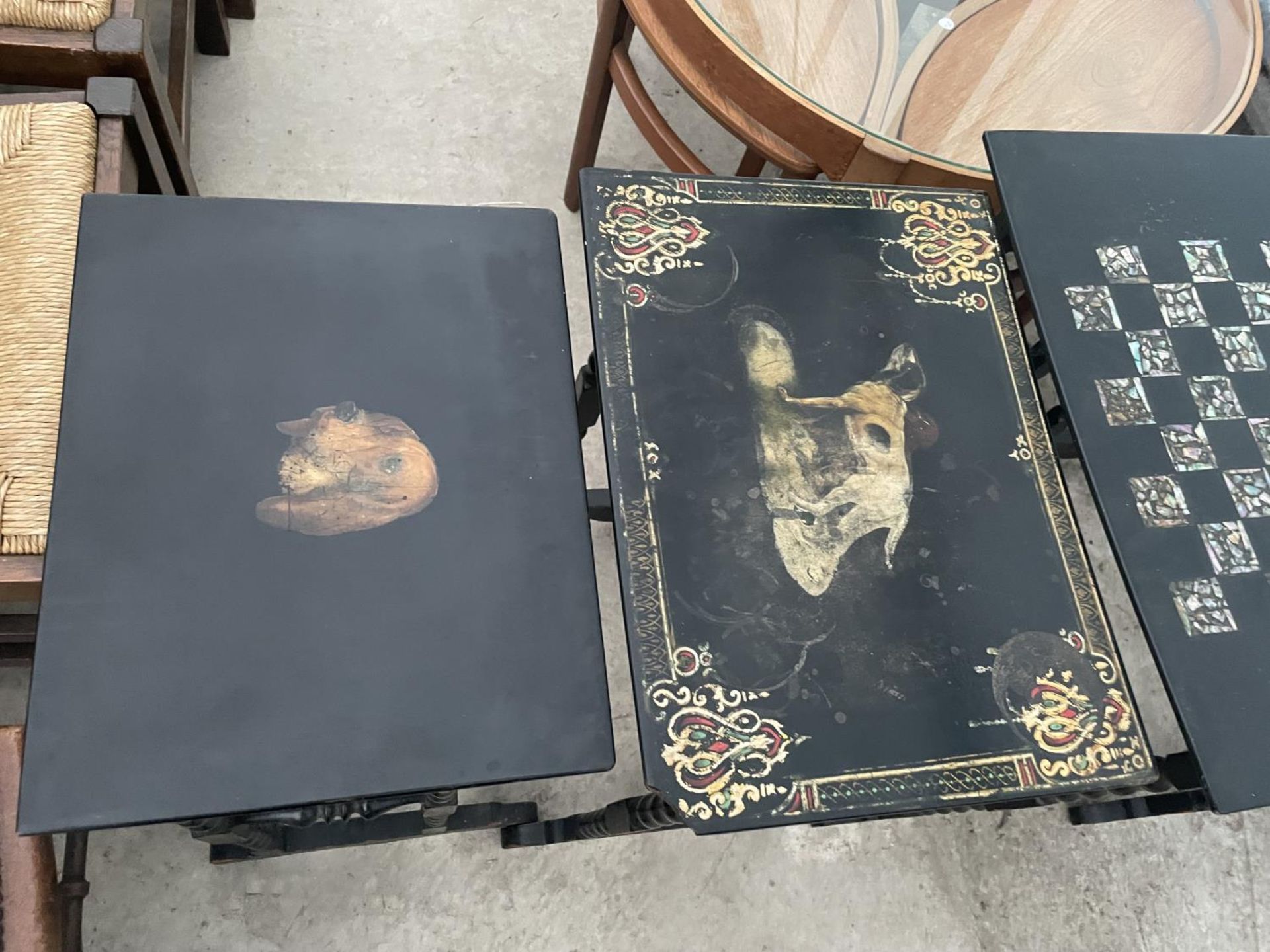 A NEST OF FOUR EBONISED AND PAPIER MACHE TABLES, THREE TABLES BEARING HUNTING IMAGE AND ONE WITH - Image 2 of 9