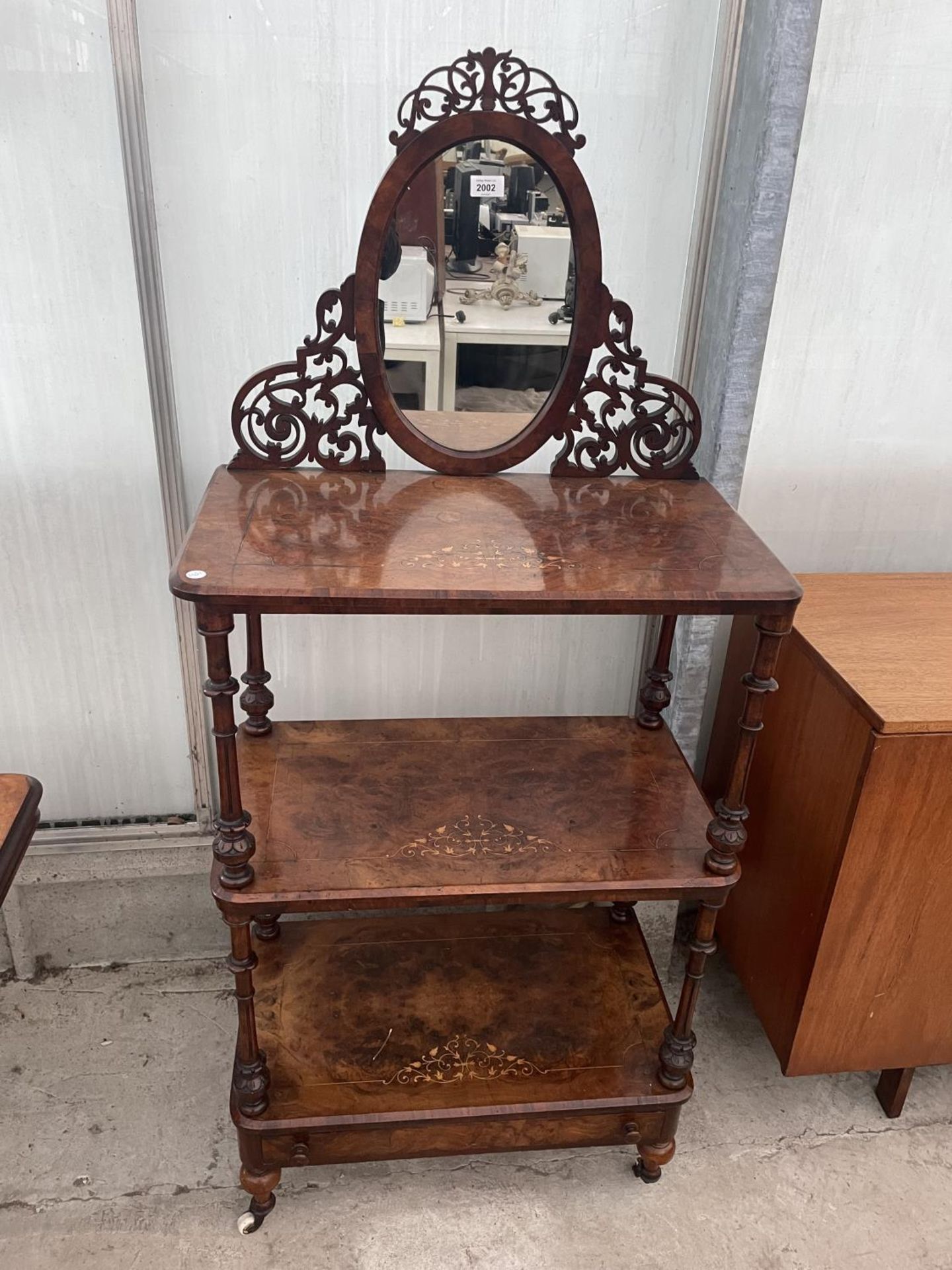 A VICTORIAN WALNUT AND INLAID THREE TIER WHATNOT WITH FRETWORK MIRROR-BACK ON TURNED SUPPORTS,