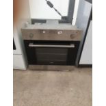 A SILVER AND BLACK INTERGRATED IGNIS OVEN BELIEVED IN WORKING ORDER BUT NO WARRANTY