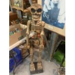 A TALL WOODEN CARVED SKELETON FIGURINE H:114CM