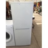 A WHITE CURRYS ESSENTIAL UPRIGHT FRIDGE FREEZER BELIEVED IN WORKING ORDER BUT NO WARRANTY