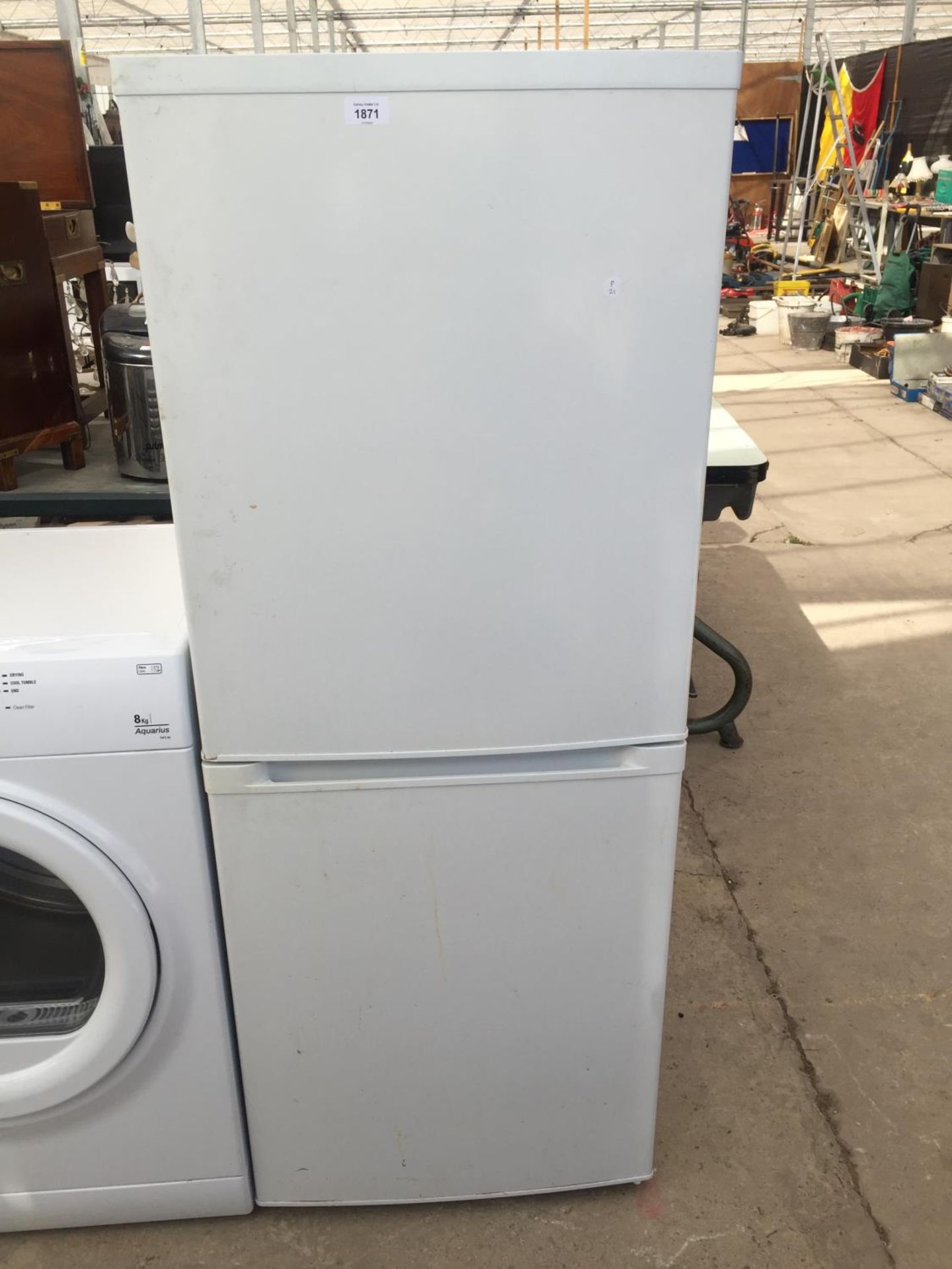A WHITE CURRYS ESSENTIAL UPRIGHT FRIDGE FREEZER BELIEVED IN WORKING ORDER BUT NO WARRANTY
