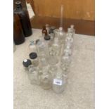 AN ASSORTMENT OF GLASS LAB BOTTLES AND JARS
