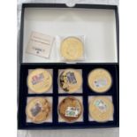 A BOXED SET OF SEVEN , LARGE SIZED , GOLD PLATED , COMMEMORATIVES , EACH WITH COA . EACH IS
