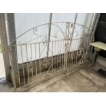A PAIR OF WHITE PAINTED WROUGHT IRON GATES