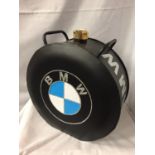 A BLACK BMW PETROL CAN WITH A BRASS TOP