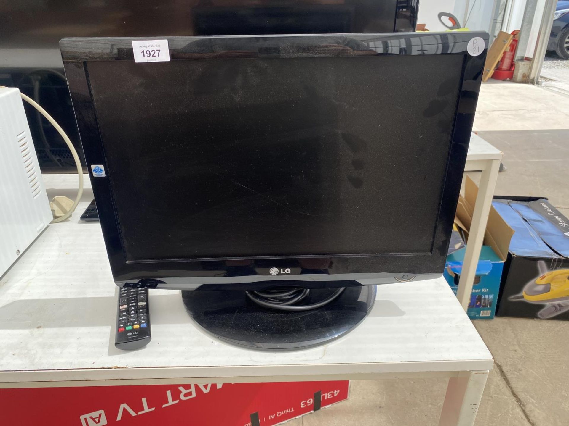 A 19" LG TELEVISION WITH REMOTE CONTROL