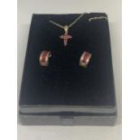 A SILVER NECKLACE WITH A RUBY CROSS PENDANT AND A PAIR OF MATCHING EARRINGS IN A PRESENTATION BOX