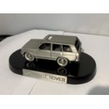 A PEWTER LAND ROVER RANGE ROVER ON A PLINTH WITH A BOX