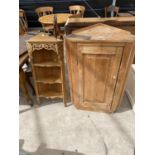 A 19TH CENTURY STYLE PINE CORNER CUPBOARD AND SET OF OPEN PINE CORNER SHELVES