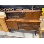 A RETRO TEAK NATHAN SIDEBOARD ENCLOSING CUPBOARD, GLASS SLIDING DOORS WITH TIMES FURNISHING LABEL