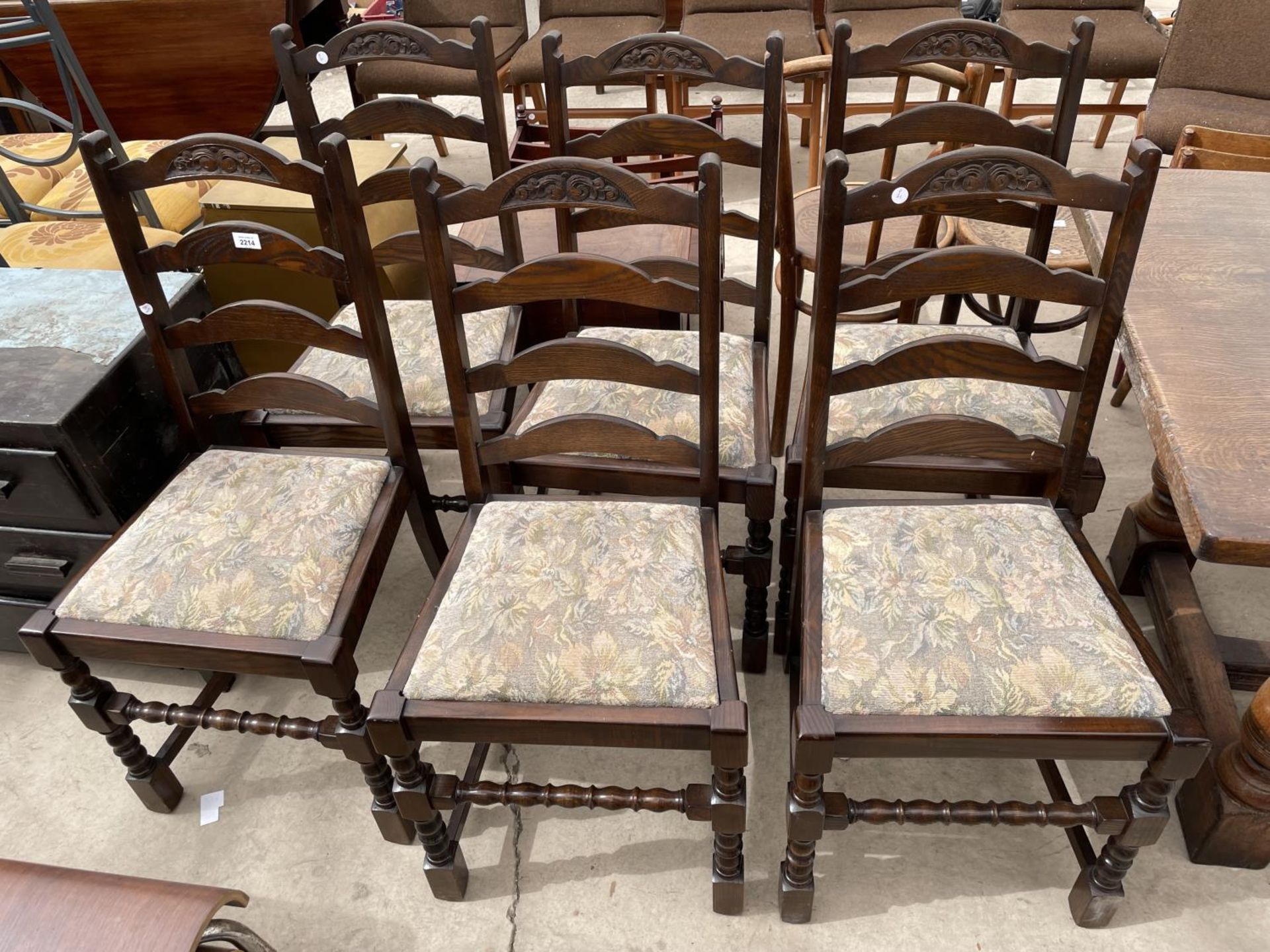 A SET OF SIX OAK REPRODUCTION LADDERBACK DINING CHAIRS ON TURNED LEGS