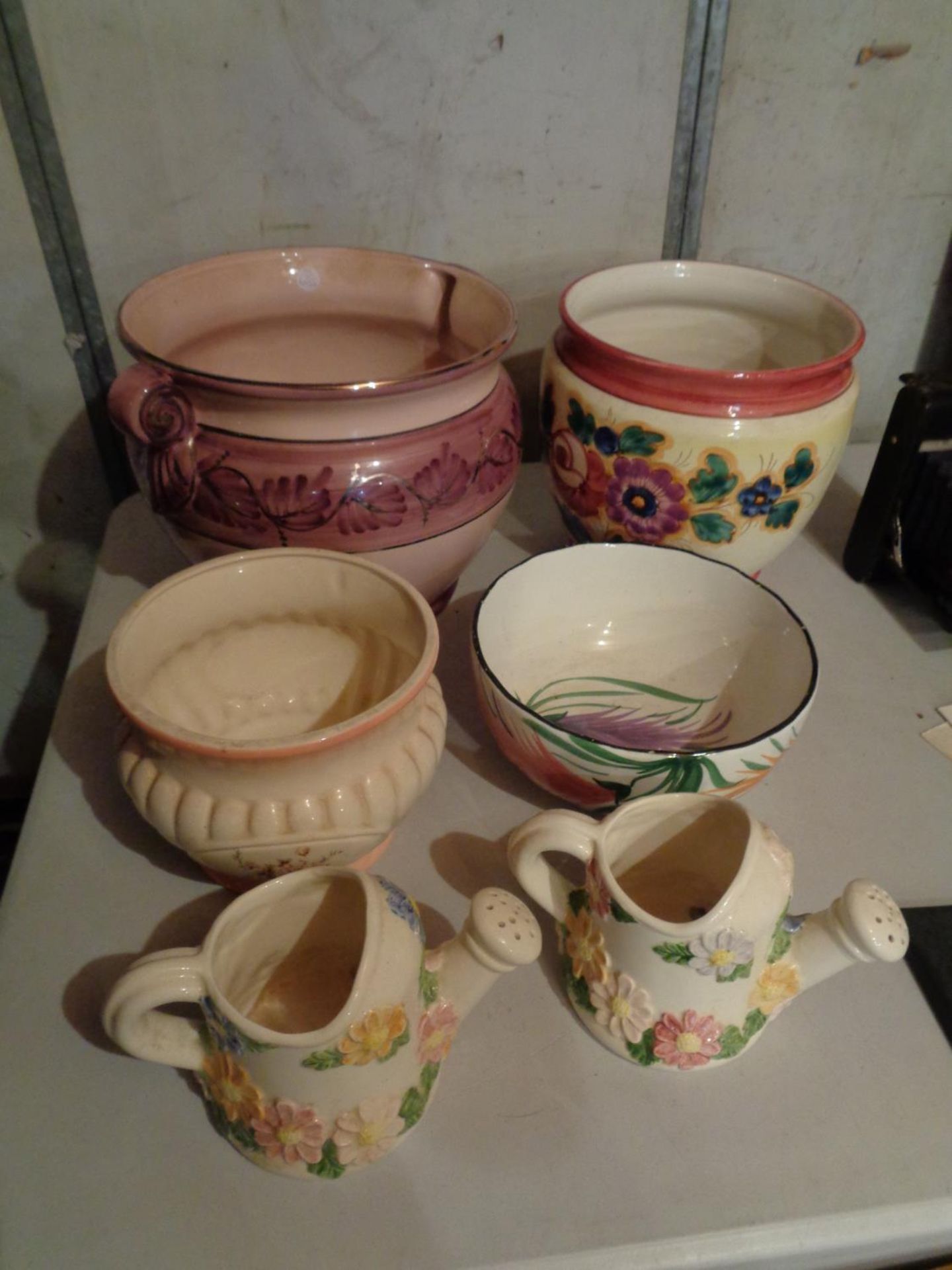 A SELECTION OF LARGE POTS AND TWO CERAMIC FLORAL WATERING CANS