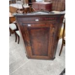 A GEORGE III OAK CROSSBANDED SHELL INLAID CORNER CUPBOARD WITH SHAPED INTERIOR SHELVES, 31" WIDE