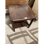 AN OAK OCCASIONAL TABLE WITH LOWER SHELF