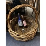 A VERY LARGE TRUG BASKET WITH A BLACK PRINCE DECANTER AND A BOTTLE OF SPAKLING APPLE JUICE