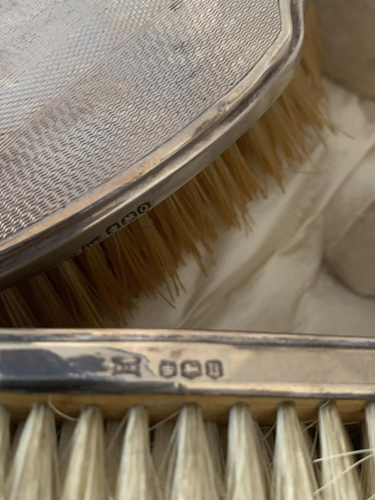 THREE HALLMARKED SHEFFILED SILVER BACKED BRUSHES IN A PRESENTATION BOX - Image 2 of 2