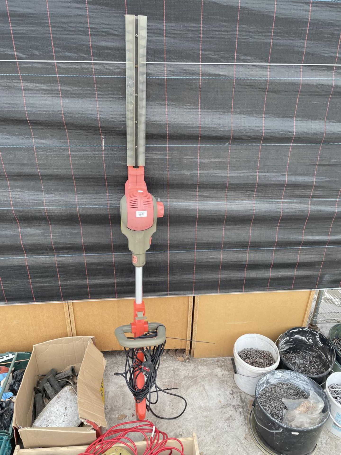 AN ELECTRIC LONG REACH HEDGE TRIMMER