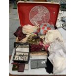 A VINTAGE CASE CONTAINING A LARGE QUANTITY OF LINEN AND LACE, A PURSE AND VARIOUS ITEMS OF COSTUME