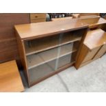 A MID 20TH CENTURY TWO DOOR BOOKCASE WITH SLIDING GLASS DOORS, 36" WIDE