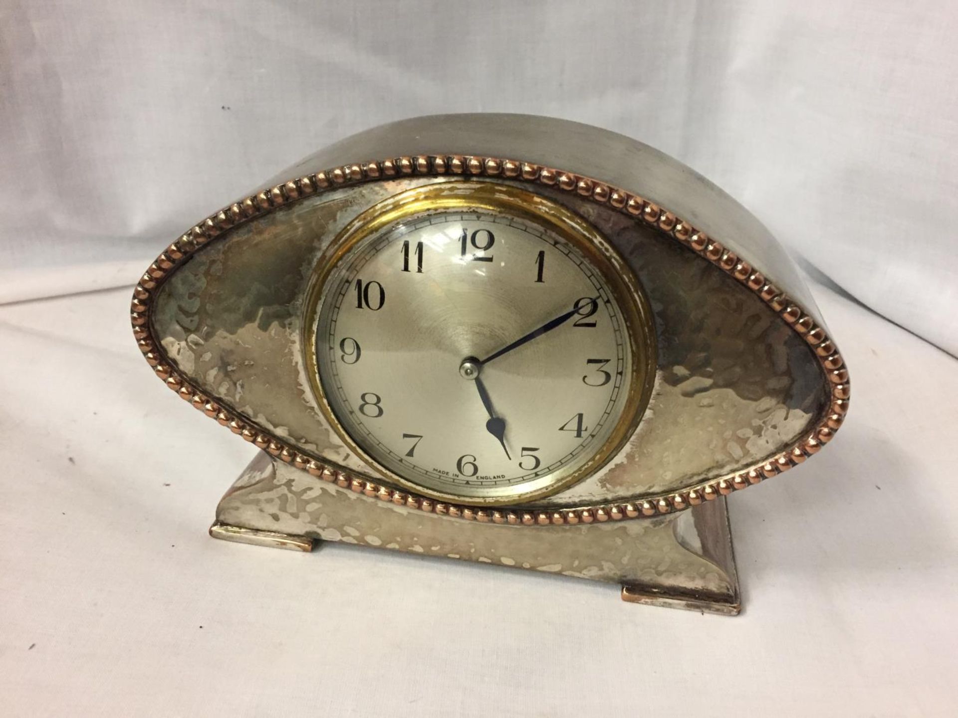 A DECO STYLE WHITE METAL MANTLE CLOCK