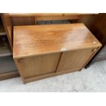 A RETRO TEAK SLIDING TWO DOOR CABINET, 31.5" WIDE