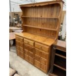 A MODERN PINE DRESSER WITH PLATE RACK, 55" WIDE