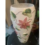 A HAND PAINTED FLOWER DESIGN UMBRELLA/ WALKING STICK STAND