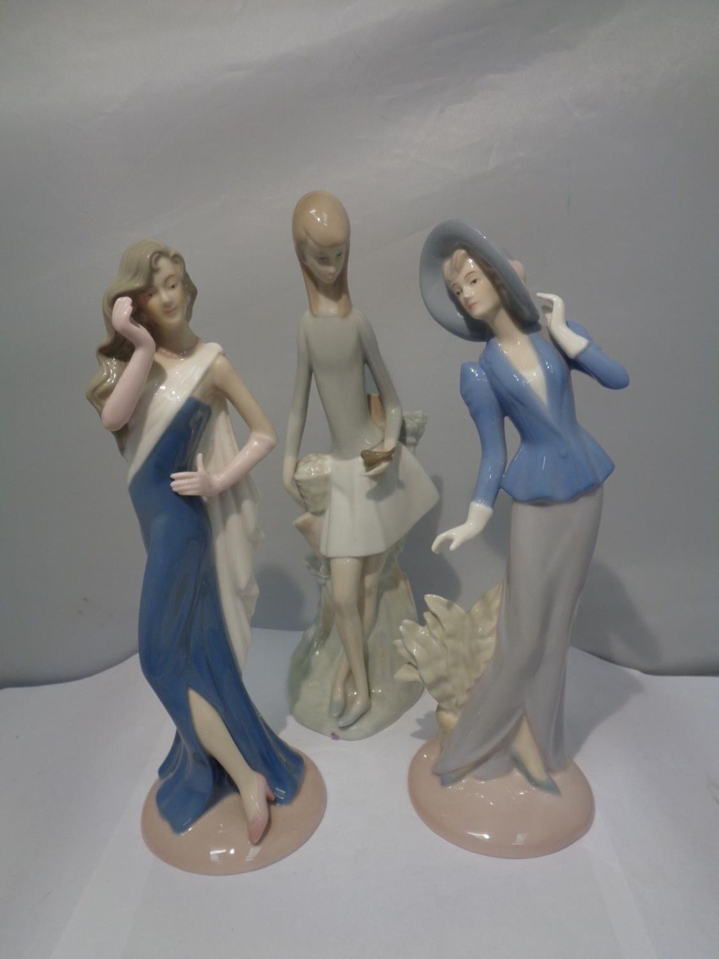 THREE CERAMIC LADIES