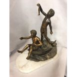 A SCULPTURE OF TWO BOYS IN A ROWING BOAT ON A MARBLE BASE