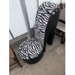 A FEATURE CHAIR IN THE FORM OF A HIGH HEEL SHOE WITH ZEBRA SKIN DESIGN FINISH