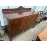 AN EARLY 20TH CENTURY MAHOGANY SIDEBOARD ON SHORT BALL AND CLAW FEET, 60" WIDE