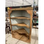 A PINE CORNER CABINET WITH THREE INNER SHELVES