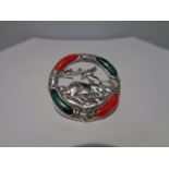 A MARKED SILVER BROOCH WITH RED AND GREEN STONES SURROUNDING A CENTRAL STAG DESIGN