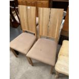 A PAIR OF MODERN OAK FRAMED DINING CHAIRS