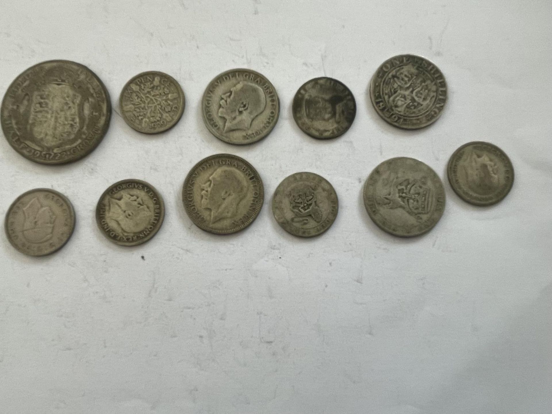 A 1922 HALF CROWN, FOUR PRE 1947 SHILLINGS AND SIX PRE 1947 SIXPENCES