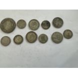 A 1922 HALF CROWN, FOUR PRE 1947 SHILLINGS AND SIX PRE 1947 SIXPENCES