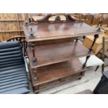 A VICTORIAN STYLE THREE TIER BUFFET WITH TURNED UPRIGHTS AND TWO DRAWERS TO THE BASE, 43" WIDE