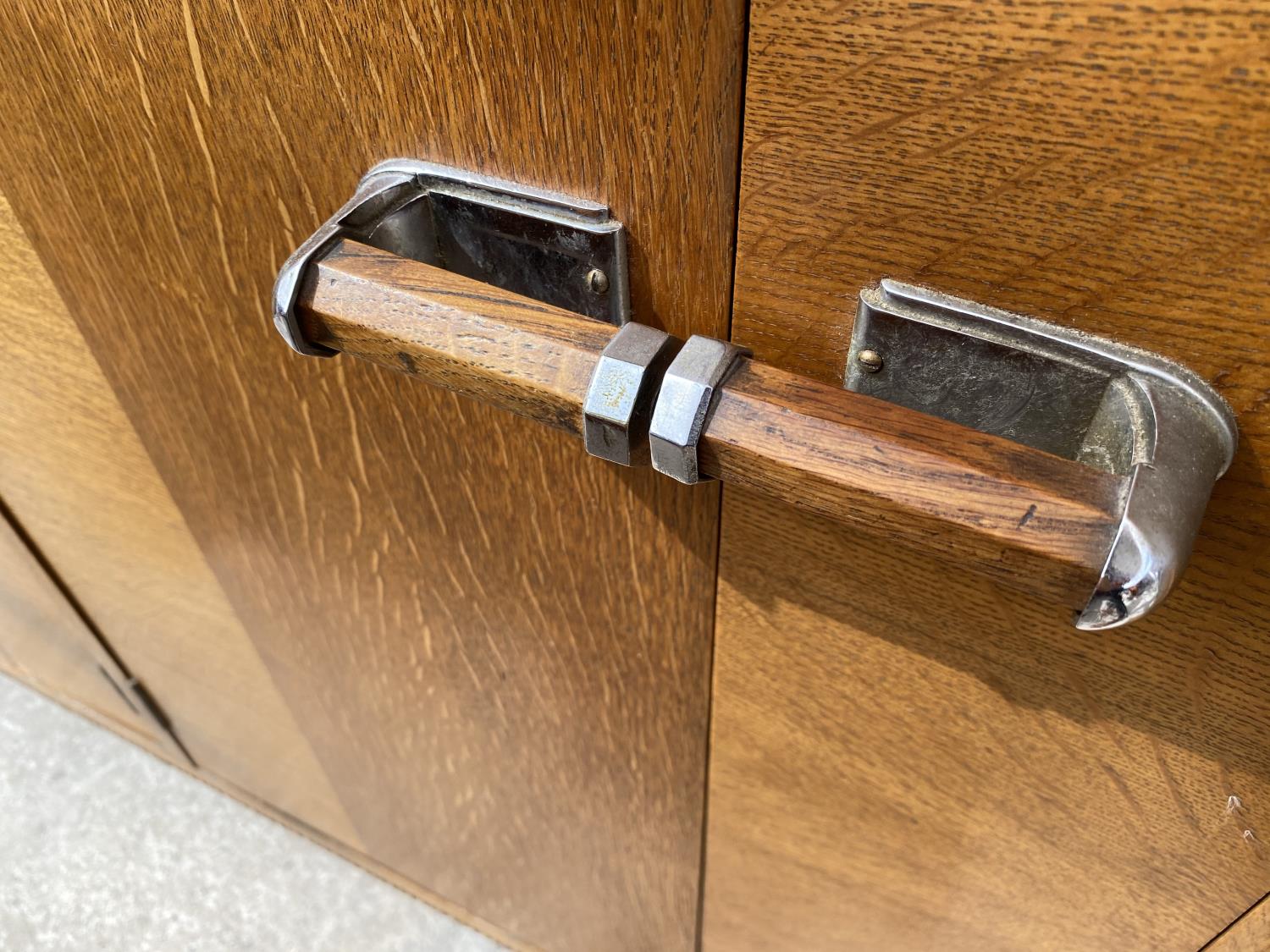 AN OAK E-GOMME SIDEBOARD DATED 1939 ENCLOSING CURVED END CUPBOARDS, TWO PAIRS OF CUPBOARDS WITH FOUR - Image 4 of 9